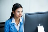 Attractive business woman Asian in suits and headsets are smilin Attractive business woman Asian in suits and headsets are smilin
