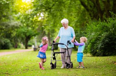 Grandmother with walker playing with two kids