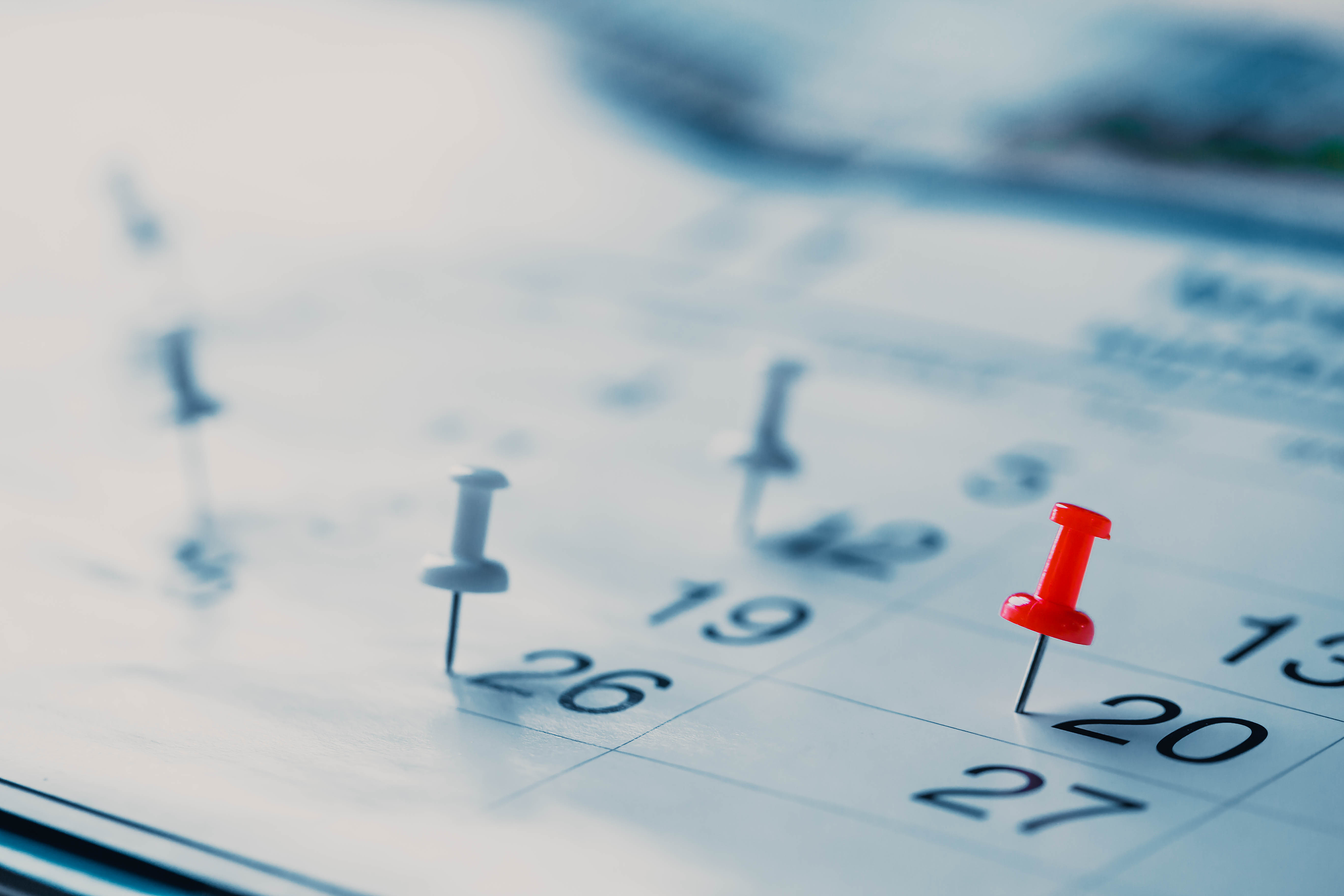 Calendar page pinned in a calender on datebusiness meeting sched